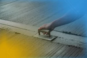 Portada de un artículo sobre concreto con una imagen estilizada de un brazo humano trabajando con el concreto