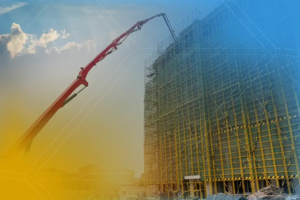 Caminhão de bombeamento de concreto em ação, fornecendo concreto para a construção de um edifício